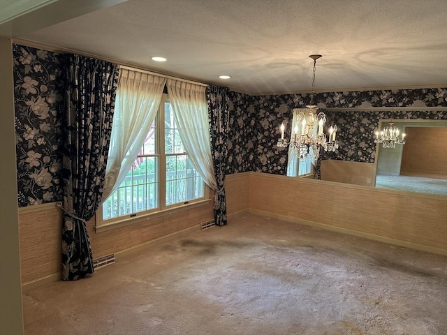 96 Wild Grove Ln, Longmeadow, MA 01106 - unfurnished dining area with wallpapered walls, a chandelier, carpet floors, baseboards, and a textured ceiling