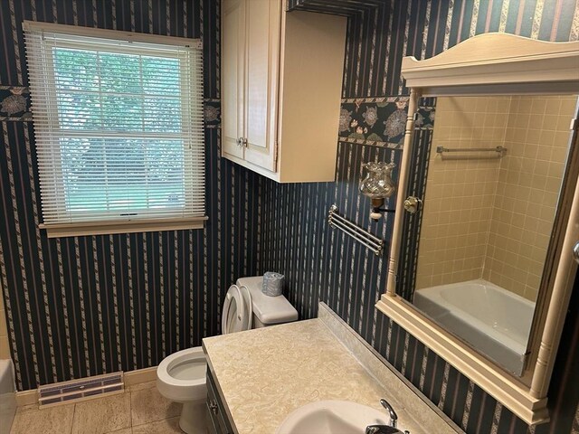 96 Wild Grove Ln, Longmeadow, MA 01106 - bathroom featuring wallpapered walls, toilet, plenty of natural light, tile patterned floors, and baseboards