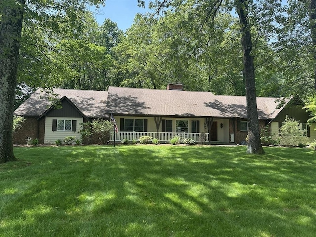 96 Wild Grove Ln, Longmeadow, MA 01106 - single story home with covered porch, a front yard, a chimney, and a shingled roof