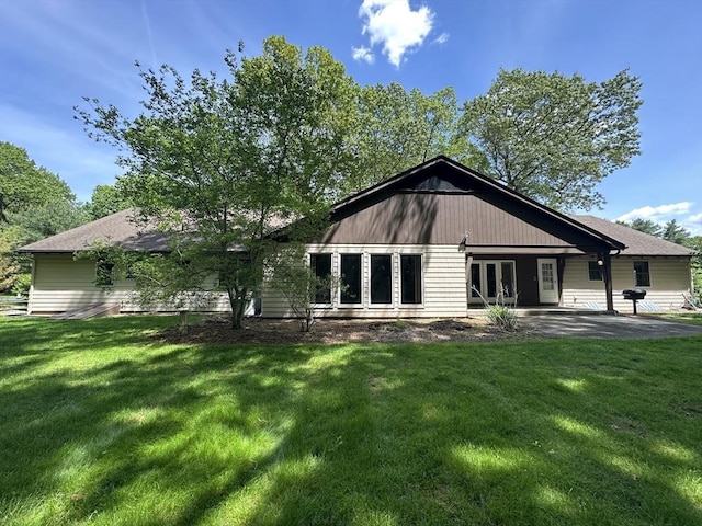 96 Wild Grove Ln, Longmeadow, MA 01106 - back of house featuring french doors, a lawn, and a patio area