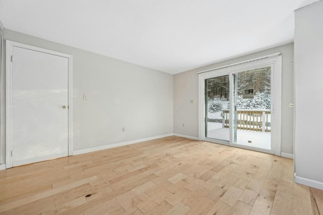 spare room featuring light wood-type flooring