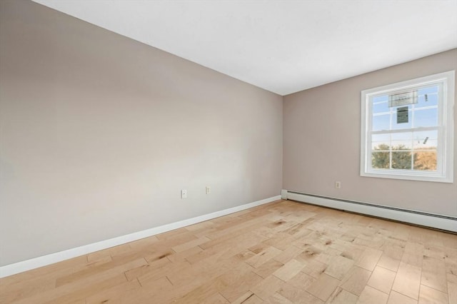 empty room with a baseboard heating unit