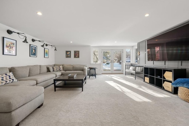 carpeted living room with french doors