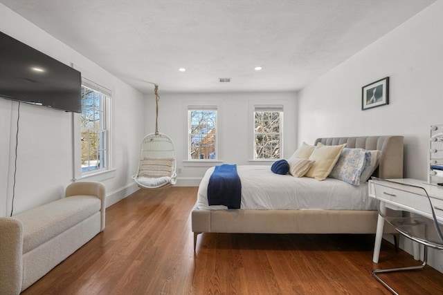 bedroom with hardwood / wood-style floors