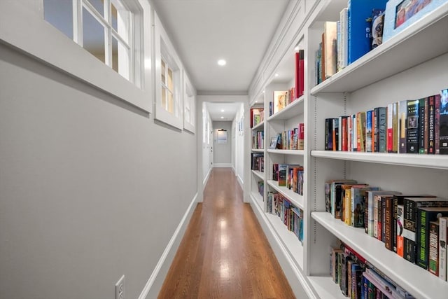 corridor with wood-type flooring