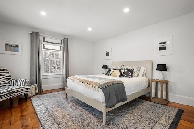 bedroom with hardwood / wood-style floors