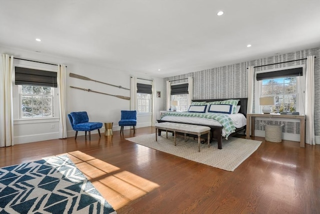 bedroom featuring hardwood / wood-style floors and multiple windows