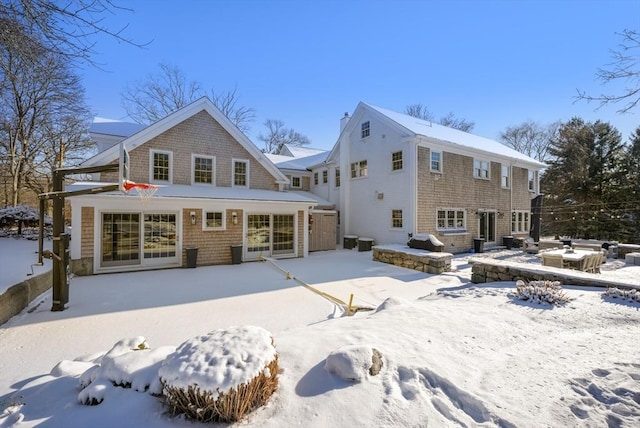 view of snow covered house