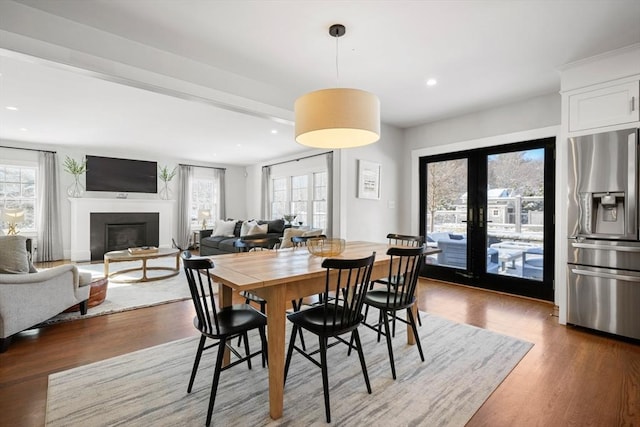 dining area featuring dark hardwood / wood-style flooring and french doors