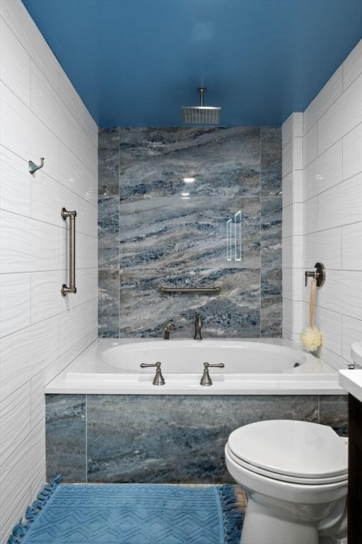 150 Lynnway Unit 406, Lynn, MA 01902 - bathroom with tile walls, vanity, and a combined bath / shower with rainfall shower