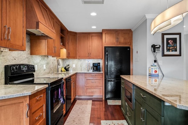 150 Lynnway Unit 406, Lynn, MA 01902 - kitchen with black appliances, dark wood finished floors, light stone countertops, decorative backsplash, and crown molding
