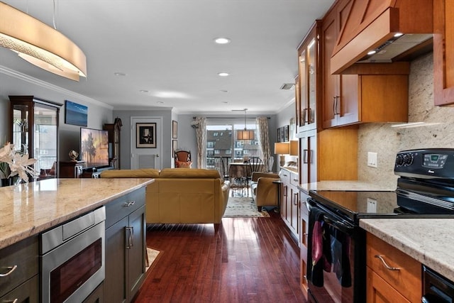 150 Lynnway Unit 406, Lynn, MA 01902 - kitchen featuring black electric range, ventilation hood, stainless steel microwave, crown molding, and open floor plan
