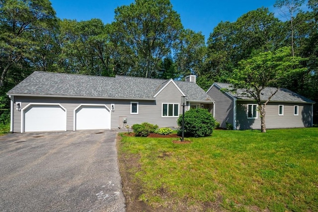 17 Indian Dawn Unit 17, Wayland, MA 01778 - single story home with driveway, a chimney, a garage, a front yard, and roof with shingles