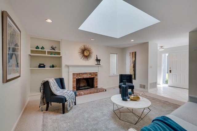 17 Indian Dawn Unit 17, Wayland, MA 01778 - living area featuring a brick fireplace, healthy amount of natural light, built in features, and recessed lighting