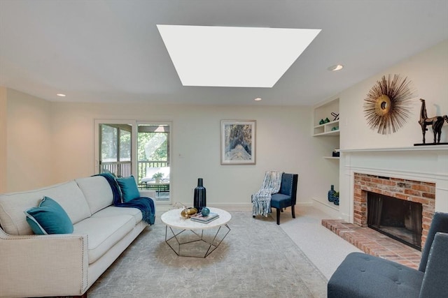 17 Indian Dawn Unit 17, Wayland, MA 01778 - carpeted living room with a fireplace, recessed lighting, and a skylight