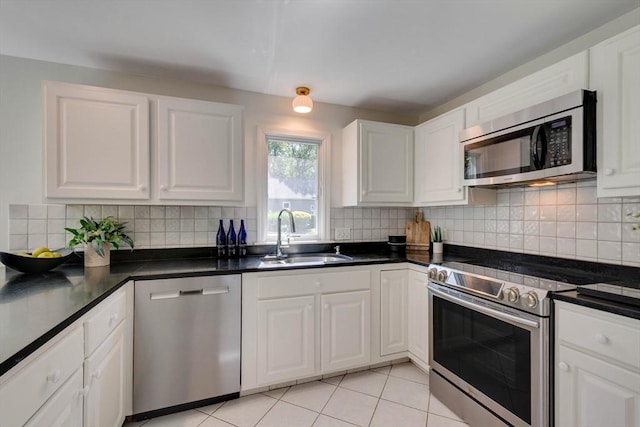 17 Indian Dawn Unit 17, Wayland, MA 01778 - kitchen featuring appliances with stainless steel finishes, white cabinetry, and decorative backsplash