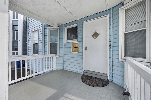doorway to property featuring covered porch