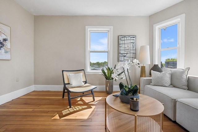 sitting room featuring light wood-style flooring and baseboards