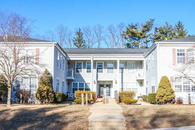 view of front of property with french doors and a front yard