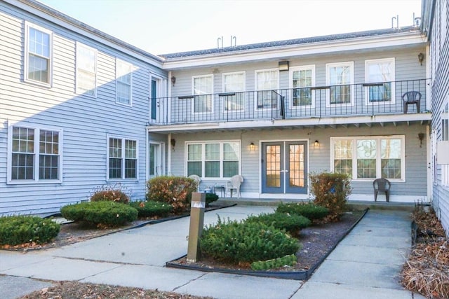 rear view of property featuring french doors