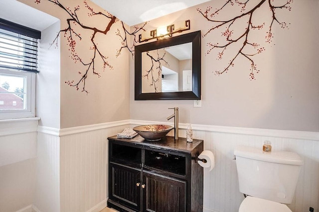 bathroom featuring toilet and vanity