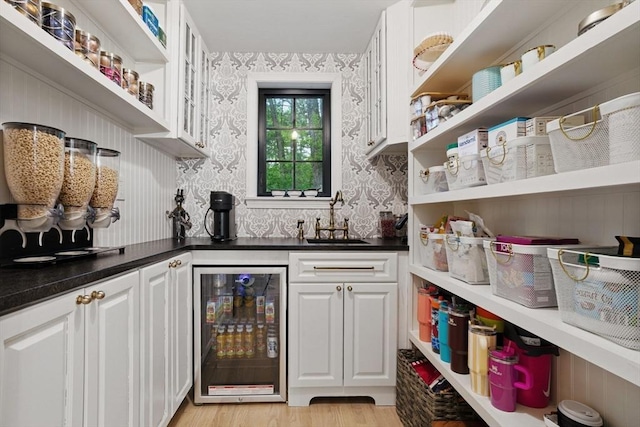 4 Rockwood Ln, Londonderry, NH 03053 - indoor bar with wine cooler, wallpapered walls, and light wood finished floors
