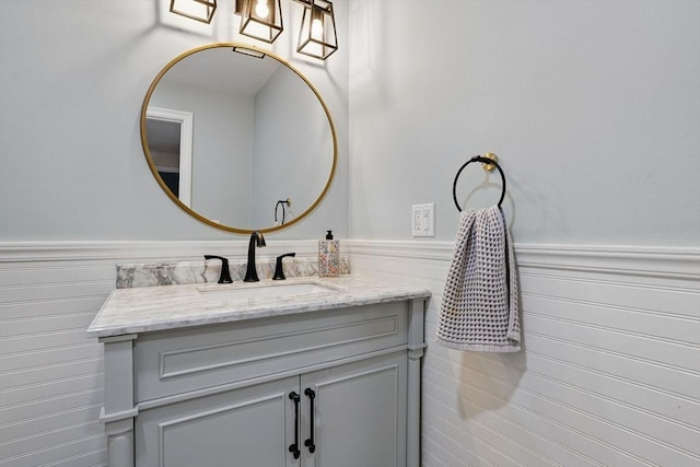 4 Rockwood Ln, Londonderry, NH 03053 - bathroom with vanity and a wainscoted wall
