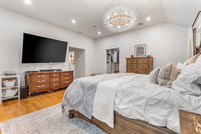 4 Rockwood Ln, Londonderry, NH 03053 - bedroom featuring hardwood / wood-style flooring, a chandelier, a walk in closet, a closet, and recessed lighting