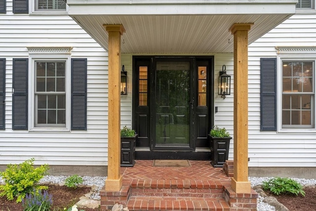 4 Rockwood Ln, Londonderry, NH 03053 - view of exterior entry featuring a porch