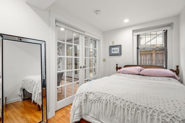 69 Saint Botolph Unit 1, Boston, MA 02116 - bedroom with wood finished floors, french doors, and recessed lighting