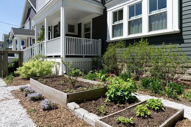 141 Fayerweather St, Cambridge, MA 02138 - view of home's exterior with a garden and a porch