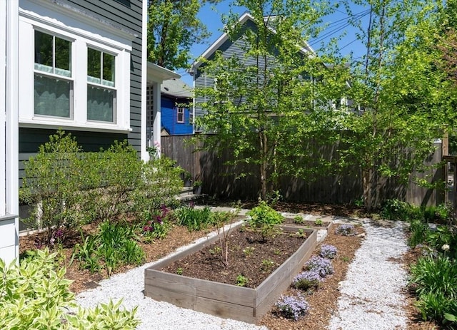 141 Fayerweather St, Cambridge, MA 02138 - view of yard featuring a vegetable garden and fence