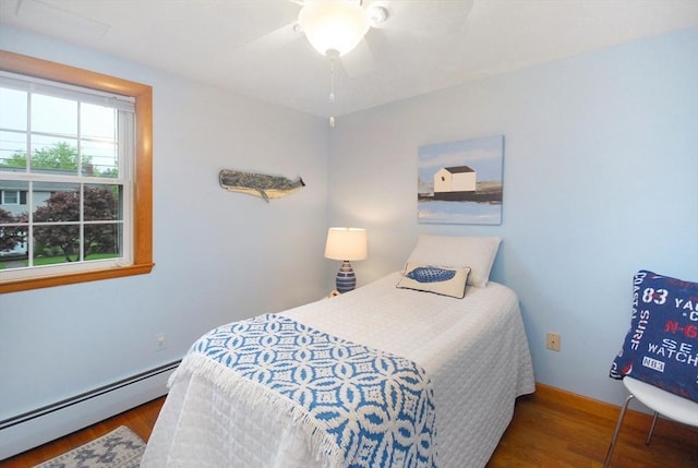 95 Bayberry Rd, Concord, MA 01742 - bedroom featuring baseboard heating, wood finished floors, baseboards, and a ceiling fan