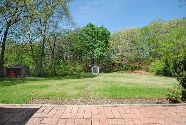 95 Bayberry Rd, Concord, MA 01742 - view of grassy yard with a shed and an outbuilding