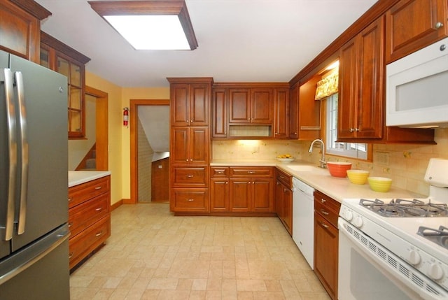 95 Bayberry Rd, Concord, MA 01742 - kitchen featuring white appliances, a sink, light countertops, and backsplash