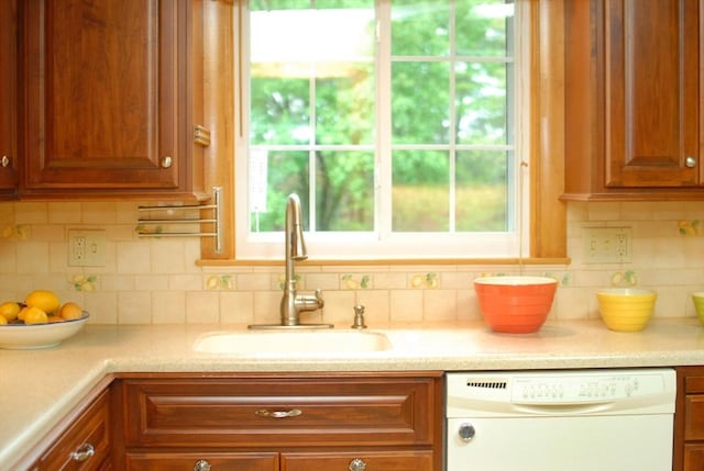 95 Bayberry Rd, Concord, MA 01742 - kitchen featuring dishwasher, a sink, light countertops, and plenty of natural light