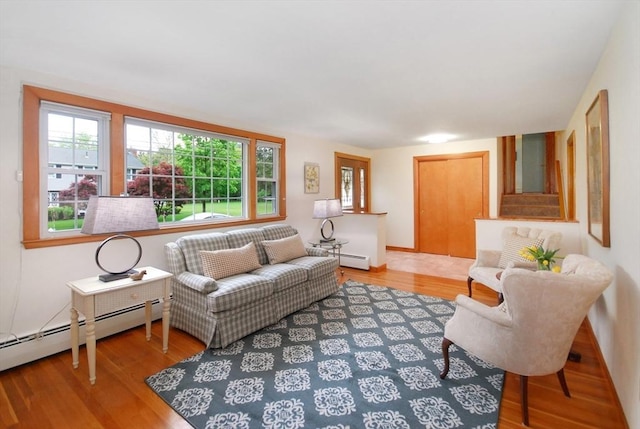 95 Bayberry Rd, Concord, MA 01742 - living area featuring a baseboard radiator, wood finished floors, and baseboards