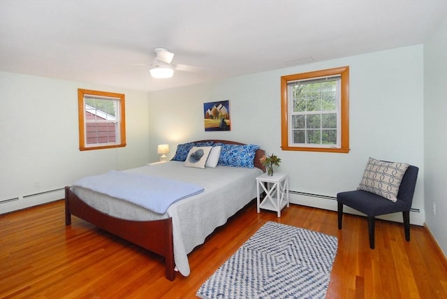 95 Bayberry Rd, Concord, MA 01742 - bedroom with wood finished floors, a ceiling fan, and baseboard heating