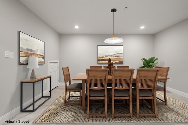 dining space with recessed lighting and baseboards