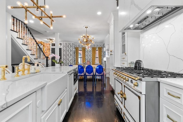 11 Beckler Ave, Boston, MA 02127 - kitchen featuring custom range hood, a chandelier, white cabinetry, stainless steel gas stovetop, and dark wood-style flooring