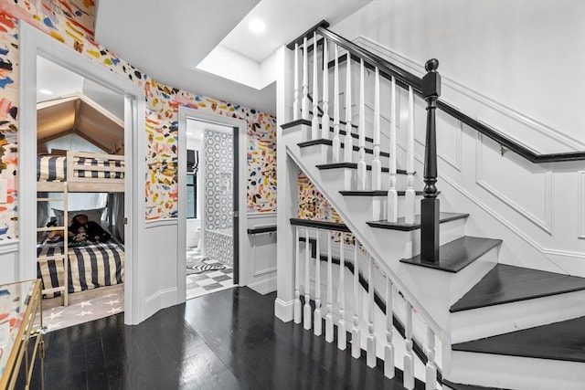 11 Beckler Ave, Boston, MA 02127 - stairway featuring wallpapered walls, a wainscoted wall, wood finished floors, recessed lighting, and a decorative wall