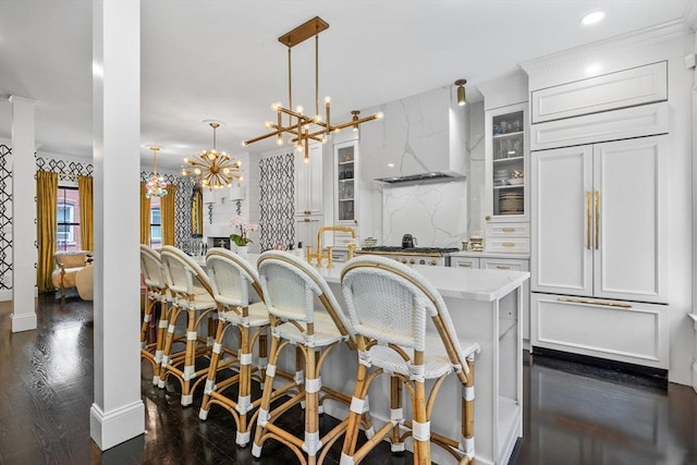 11 Beckler Ave, Boston, MA 02127 - kitchen featuring custom range hood, a breakfast bar area, dark wood-style flooring, glass insert cabinets, and recessed lighting