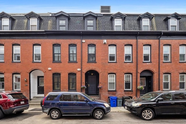 11 Beckler Ave, Boston, MA 02127 - townhome / multi-family property featuring mansard roof, brick siding, and roof with shingles