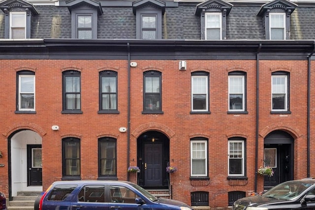 11 Beckler Ave, Boston, MA 02127 - view of front facade with mansard roof, brick siding, and a shingled roof
