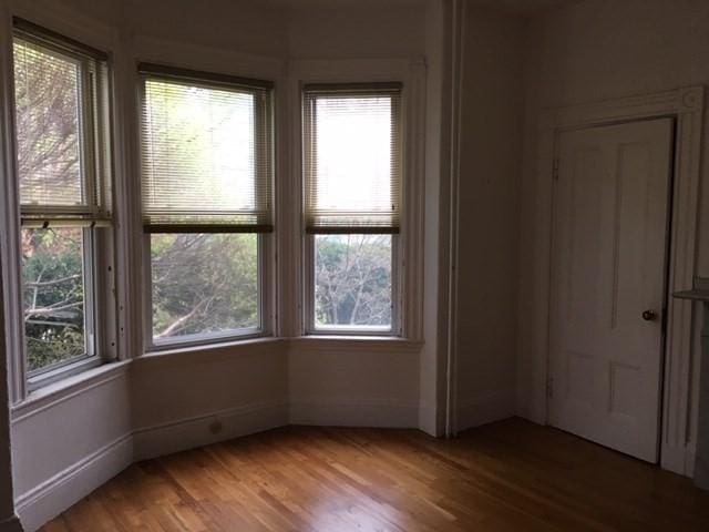 29 Conway St, Boston, MA 02131 - empty room featuring wood finished floors and baseboards