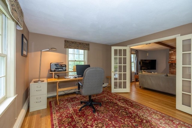 759 Main St, Boxford, MA 01921 - office featuring a baseboard heating unit, french doors, and wood finished floors
