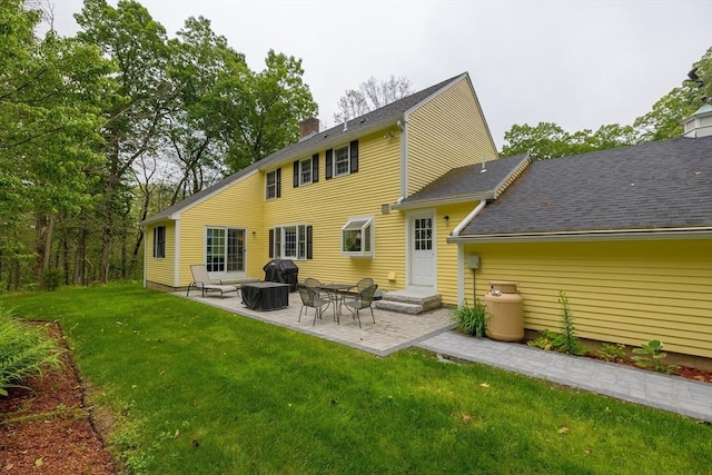 759 Main St, Boxford, MA 01921 - rear view of house with a patio area, a yard, and a chimney