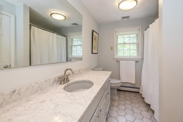 759 Main St, Boxford, MA 01921 - full bath featuring a baseboard heating unit, healthy amount of natural light, vanity, and tile patterned flooring