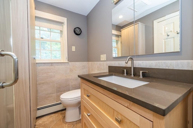 759 Main St, Boxford, MA 01921 - bathroom featuring baseboard heating, vanity, tile patterned flooring, tile walls, and a wainscoted wall