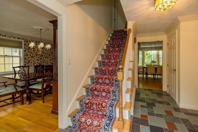 759 Main St, Boxford, MA 01921 - stairs featuring a chandelier, ornamental molding, and wood finished floors